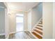 Hallway with updated flooring, natural lighting, and entryways to other rooms at 849 Wagon Wheel Cir, Fayetteville, GA 30214