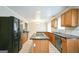 Well-lit kitchen with updated appliances, granite countertops, and a central island cooktop at 849 Wagon Wheel Cir, Fayetteville, GA 30214