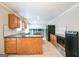 Spacious kitchen featuring wooden cabinets, stone countertops, and stainless steel appliances at 849 Wagon Wheel Cir, Fayetteville, GA 30214