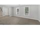 Bright living room with neutral carpet, white trim, and natural light at 849 Wagon Wheel Cir, Fayetteville, GA 30214