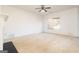 Spacious living room featuring a ceiling fan and large window at 1281 Heartwood Ave, Mcdonough, GA 30253