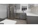 Modern kitchen with stainless steel appliances and gray cabinets at 195 Pine Bridge Trl, Johns Creek, GA 30022