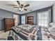 Stylish bedroom featuring ship lap accent wall, complemented by natural light from multiple windows and a ceiling fan at 1009 Fairway Seven, Villa Rica, GA 30180