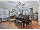 Inviting dining room with hardwood floors, fireplace, decorative accents, and ample natural light at 1009 Fairway Seven, Villa Rica, GA 30180