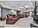 Basement Living Room with reclining sofas, carpeted floors, and a ceiling fan at 1009 Fairway Seven, Villa Rica, GA 30180