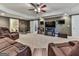 Spacious living room featuring a ceiling fan, a fireplace, and comfortable seating at 1009 Fairway Seven, Villa Rica, GA 30180