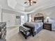 Bright bedroom with tray ceiling, ensuite bathroom access, and hardwood furniture set at 1009 Fairway Seven, Villa Rica, GA 30180