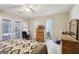 Bedroom features tile flooring, a ceiling fan, and access to a bathroom at 3863 Meeting St, Duluth, GA 30096