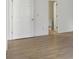 Bedroom with light-colored wood floors and view of a bathroom at 3863 Meeting St, Duluth, GA 30096