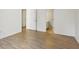 Bedroom with light-colored wood floors and view of a bathroom at 3863 Meeting St, Duluth, GA 30096