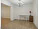 Bright dining room with hardwood floors and a modern chandelier, ready for gatherings at 3863 Meeting St, Duluth, GA 30096