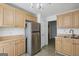 Kitchen with stainless steel refrigerator and wood cabinets at 3863 Meeting St, Duluth, GA 30096