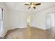 Large main bedroom featuring an ensuite bathroom, wood-look floors, and neutral paint at 3863 Meeting St, Duluth, GA 30096