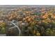 Overhead view of the neighborhood with homes nestled among dense autumn foliage and winding roads at 2825 Battlecrest Dr, Decatur, GA 30034