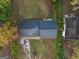 An aerial view of a home with a driveway in a verdant, tree-filled setting at 2825 Battlecrest Dr, Decatur, GA 30034