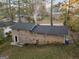 Exterior rear view featuring the house's brick facade and ample backyard space at 2825 Battlecrest Dr, Decatur, GA 30034