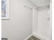 Clean bathroom featuring a white shower with a light gray wall and a window to let in natural light at 2825 Battlecrest Dr, Decatur, GA 30034