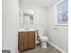 Bathroom features a vanity, toilet, and window providing natural light at 2825 Battlecrest Dr, Decatur, GA 30034