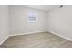 Clean bedroom features neutral walls, wood flooring, and a bright window at 2825 Battlecrest Dr, Decatur, GA 30034