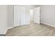 A bedroom with wood floors, closet, and views to additional rooms at 2825 Battlecrest Dr, Decatur, GA 30034