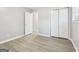 Bedroom featuring new flooring, closet, and fresh paint at 2825 Battlecrest Dr, Decatur, GA 30034