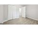 Bedroom showing the closet and light hardwood style flooring at 2825 Battlecrest Dr, Decatur, GA 30034