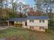 Charming two-story home with a brick facade and a well-maintained front yard at 2825 Battlecrest Dr, Decatur, GA 30034