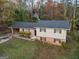 Charming single-Gathering home with well-maintained front yard surrounded by mature trees at 2825 Battlecrest Dr, Decatur, GA 30034