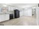 Kitchen with white cabinets, black appliances, and dining area at 2825 Battlecrest Dr, Decatur, GA 30034
