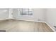 Living room featuring wood flooring and a bright window at 2825 Battlecrest Dr, Decatur, GA 30034