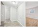 Versatile room featuring wood flooring, with an entry closet and access to another room at 2825 Battlecrest Dr, Decatur, GA 30034