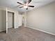 Bright bedroom has plush carpet, closet, and a ceiling fan for extra comfort at 5828 Union Walk Dr, Union City, GA 30291