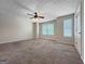Large bedroom with carpeted floors, neutral paint, and natural light, ideal for creating a relaxing retreat at 5828 Union Walk Dr, Union City, GA 30291