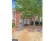 Charming brick townhome with a well-maintained front yard and a mature shade tree enhancing curb appeal at 5828 Union Walk Dr, Union City, GA 30291