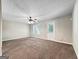 Neutral living room with carpet, white trim, and lots of space for entertaining at 5828 Union Walk Dr, Union City, GA 30291