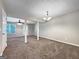 Expansive living area with carpeting, neutral walls, and an open layout, ideal for entertaining or relaxation at 5828 Union Walk Dr, Union City, GA 30291