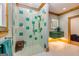 Bathroom showcasing a stylish glass shower with turquoise and white tiling, plus a vanity at 242 Kirkley Rd, Tyrone, GA 30290