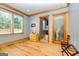 Comfortable bedroom with hardwood floors, natural light, and classic wooden trim at 242 Kirkley Rd, Tyrone, GA 30290