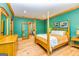 A green-walled primary bedroom with a wooden four-poster bed and lots of natural light at 242 Kirkley Rd, Tyrone, GA 30290