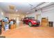 Spacious garage includes an automatic overhead door, ample storage, and parking space for a vehicle at 242 Kirkley Rd, Tyrone, GA 30290