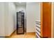 Storage room includes a metal cabinet with wood trim and hardwood floors at 242 Kirkley Rd, Tyrone, GA 30290
