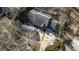 An aerial view of a home and separate garage with a large driveway at 5479 Dorsett Shoals Rd, Douglasville, GA 30135