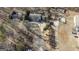 Aerial view of the property and neighborhood, showcasing the spacious lot and surrounding landscape at 5479 Dorsett Shoals Rd, Douglasville, GA 30135