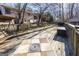 A view of the back deck with seating, table and BBQ with the house in the background at 5479 Dorsett Shoals Rd, Douglasville, GA 30135