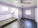 Charming bedroom featuring two skylights, a ceiling fan and gray wood-look floors at 5479 Dorsett Shoals Rd, Douglasville, GA 30135