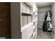 Organized walk-in closet with shelving, drawers, and hanging space for optimal storage and organization at 5479 Dorsett Shoals Rd, Douglasville, GA 30135