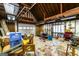 Spacious garage interior with exposed wood beams and ample storage space at 5479 Dorsett Shoals Rd, Douglasville, GA 30135