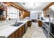 Charming kitchen with custom cabinets, stainless steel appliances, and lots of natural light at 5479 Dorsett Shoals Rd, Douglasville, GA 30135