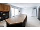 Open kitchen area with a large island and adjacent dining space, perfect for gatherings and everyday living at 5479 Dorsett Shoals Rd, Douglasville, GA 30135