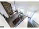 Open-concept living room features a stone fireplace, ceiling fan, and lots of natural light at 5479 Dorsett Shoals Rd, Douglasville, GA 30135
